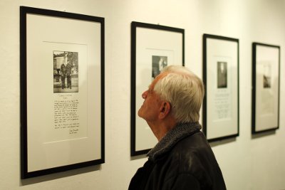 Image of a man looking at photographs