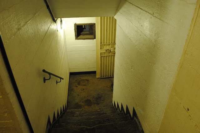 Steps from tunnels to bunker entrance, with an armored port for defensive fire