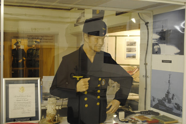 German Naval uniforms and other memorabilia in display cases