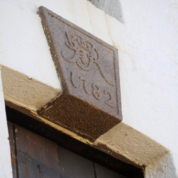 Keystone above the tower's entrance door with the year 1782